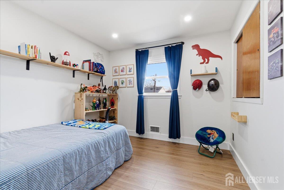 83 Garfield Avenue Colonia, NJ 07067 - Photo 21 of 45 a bedroom with a bed and a window
