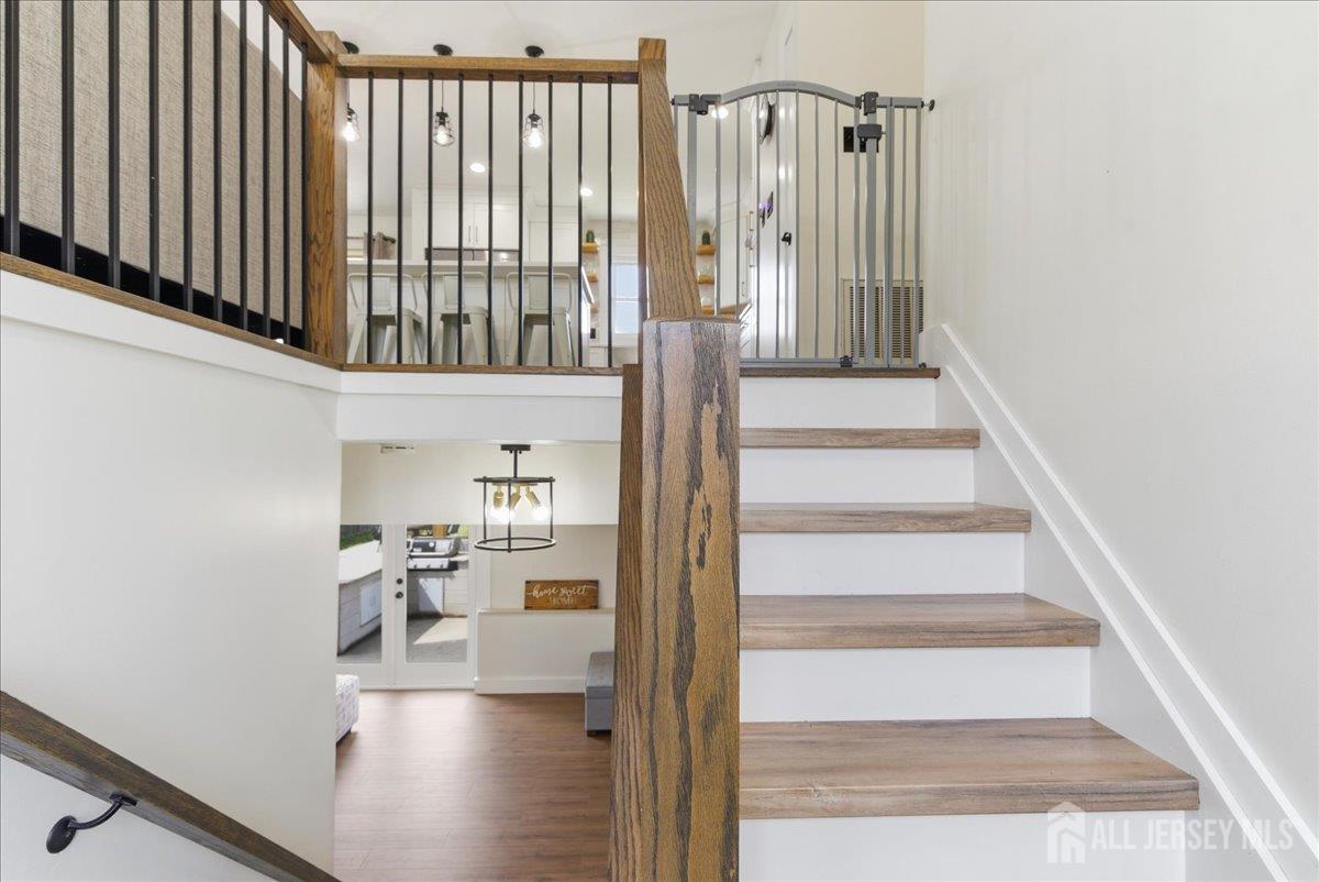 83 Garfield Avenue Colonia, NJ 07067 - Photo 25 of 45 a view of staircase with white walls and a window