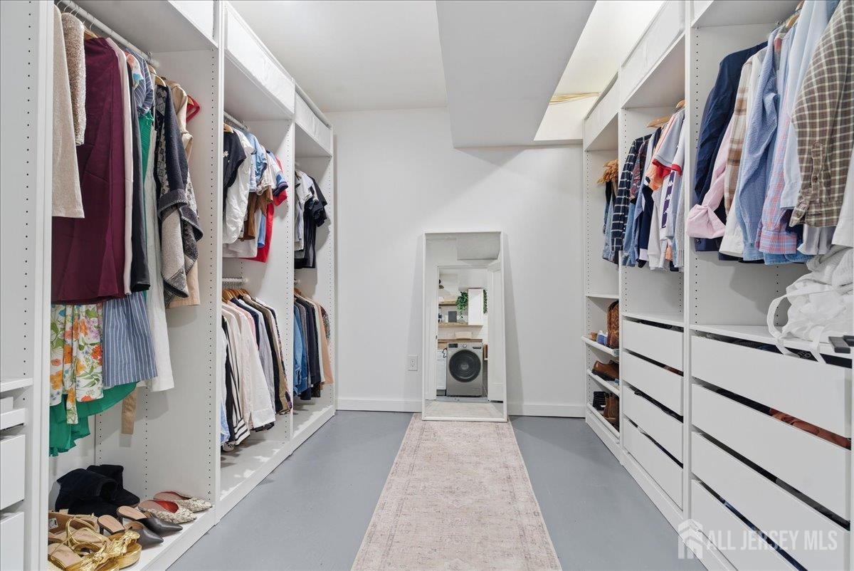 83 Garfield Avenue Colonia, NJ 07067 - Photo 29 of 45 a view of walk in closet with clothes and shoes