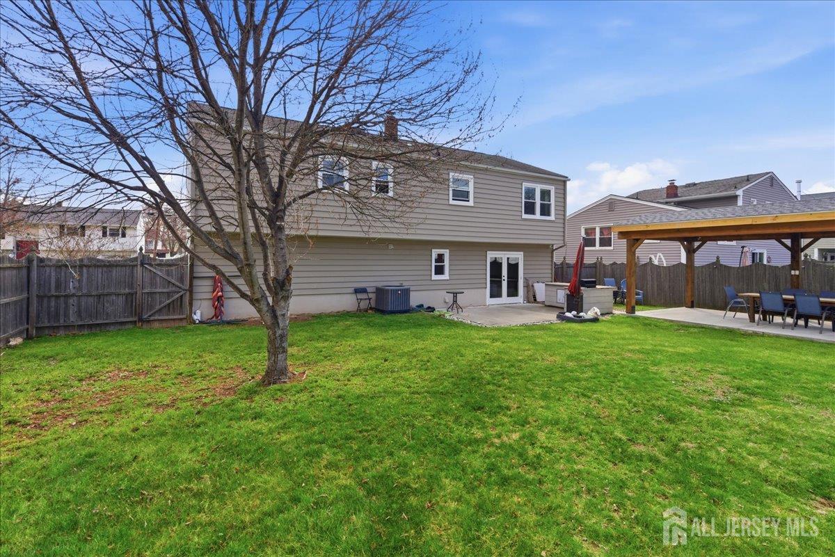83 Garfield Avenue Colonia, NJ 07067 - Photo 33 of 45 a front view of a house with a garden and porch