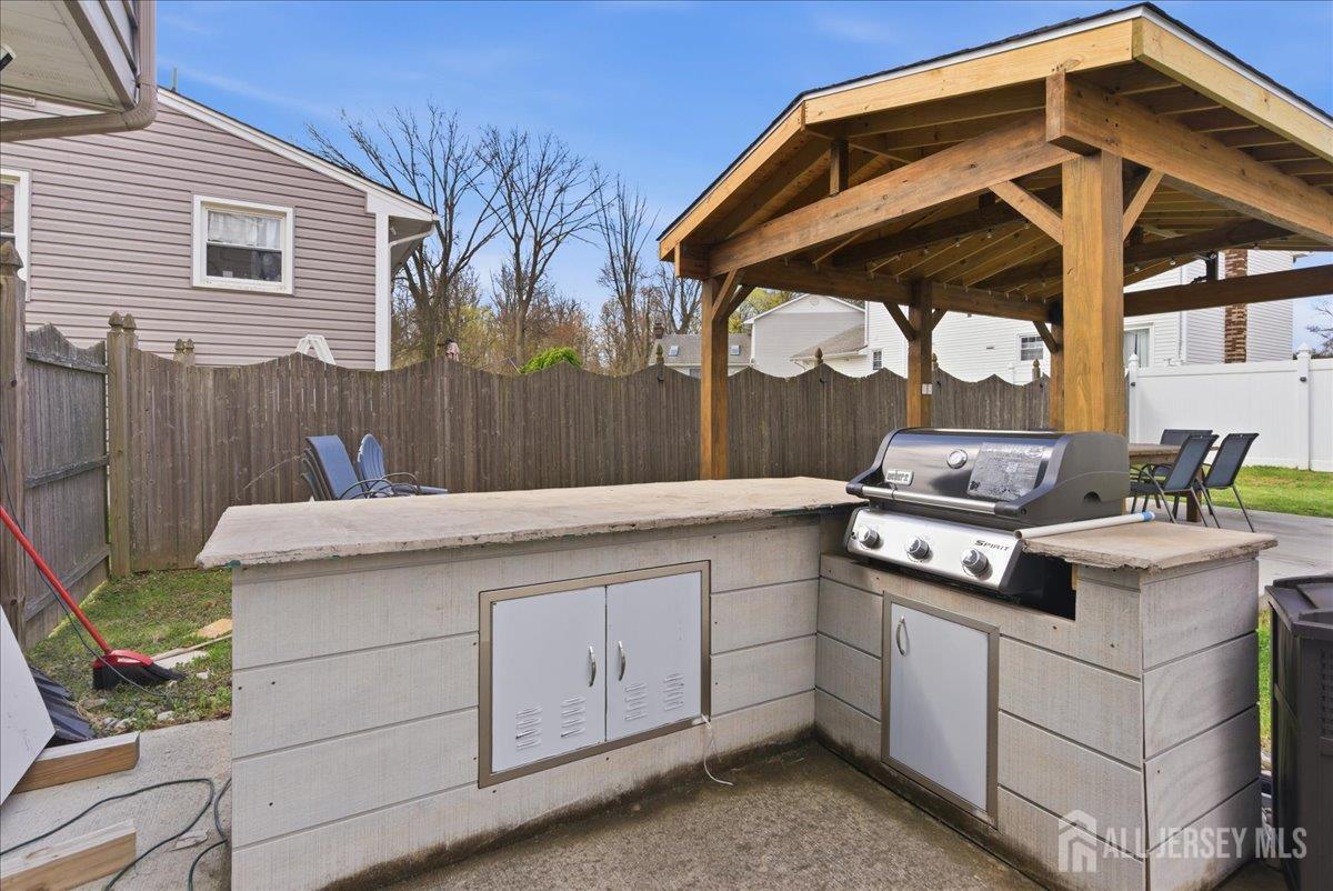 83 Garfield Avenue Colonia, NJ 07067 - Photo 37 of 45 a white stove top oven sitting inside of a kitchen