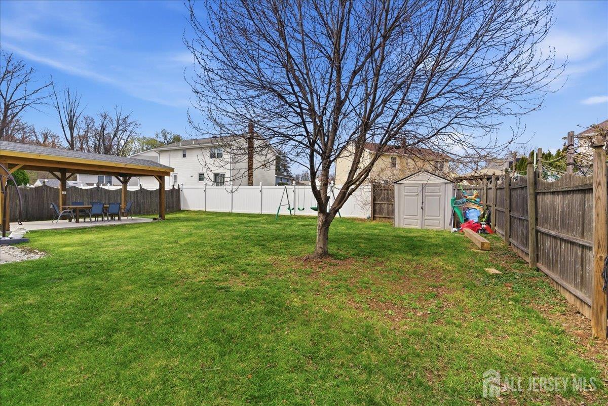 83 Garfield Avenue Colonia, NJ 07067 - Photo 39 of 45 a view of a building with a yard