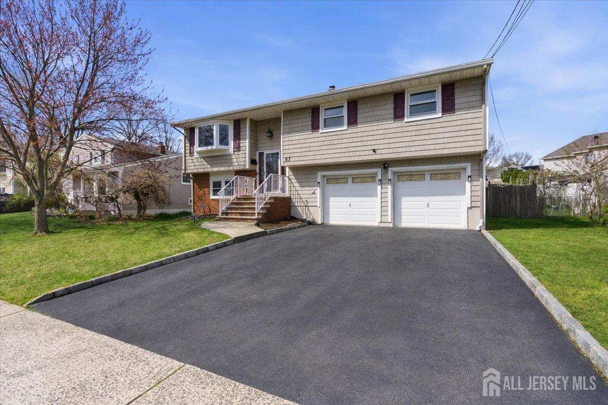 83 Garfield Avenue Colonia, NJ 07067 - Photo 40 of 45 a house view with a garden space