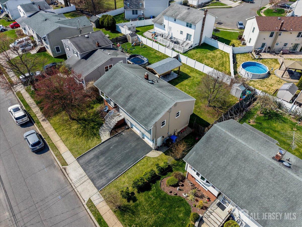 83 Garfield Avenue Colonia, NJ 07067 - Photo 41 of 45 an aerial view of a house with a garden