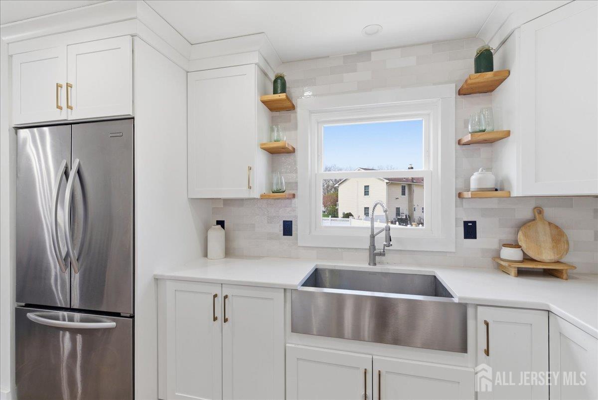 83 Garfield Avenue Colonia, NJ 07067 - Photo 5 of 45 a kitchen with appliances a sink and cabinets