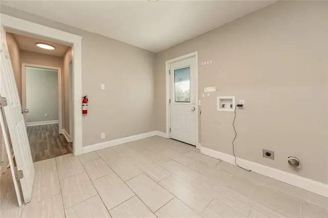 a bathroom with a toilet sink vanity and mirror