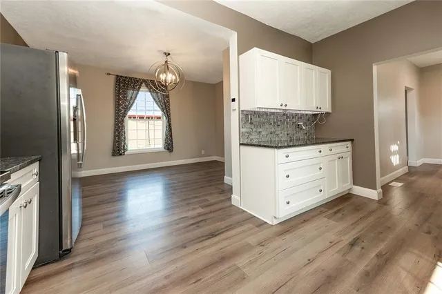 a view of a kitchen cabinets and wooden floor