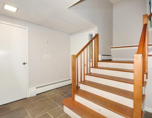 52 Temple Road Concord, MA 01742 - Photo 2 of 13 a view of entryway with wooden floor and stairs