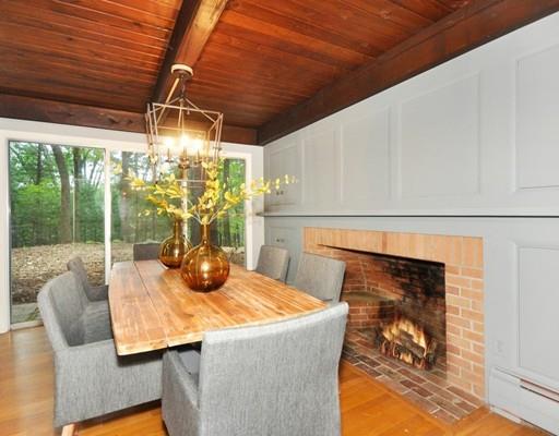 52 Temple Road Concord, MA 01742 - Photo 4 of 13 a view of a dining room with furniture wooden floor and a potted plant
