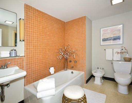 52 Temple Road Concord, MA 01742 - Photo 7 of 13 a white toilet sitting next to a bathroom sink
