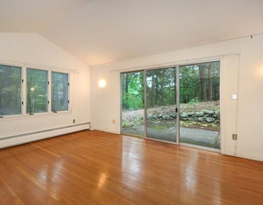 52 Temple Road Concord, MA 01742 - Photo 8 of 13 an empty room with wooden floor and sliding door