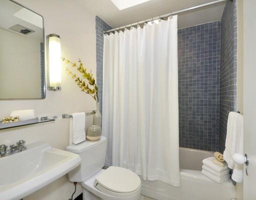 52 Temple Road Concord, MA 01742 - Photo 10 of 13 a bathroom with a sink toilet and shower