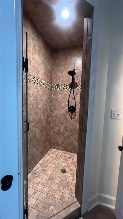 8434 Majors Road Cumming, GA 30041 - Photo 11 of 23 a bathroom with a shower