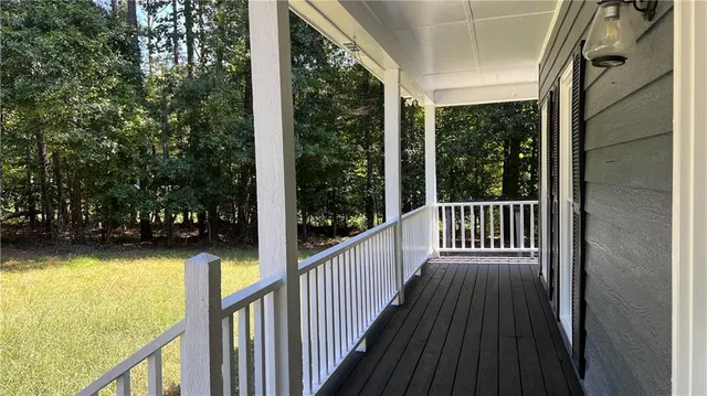 a view of balcony with wooden floor