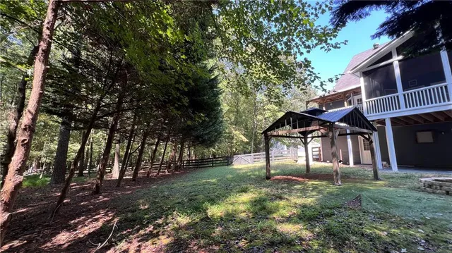 a view of house with yard