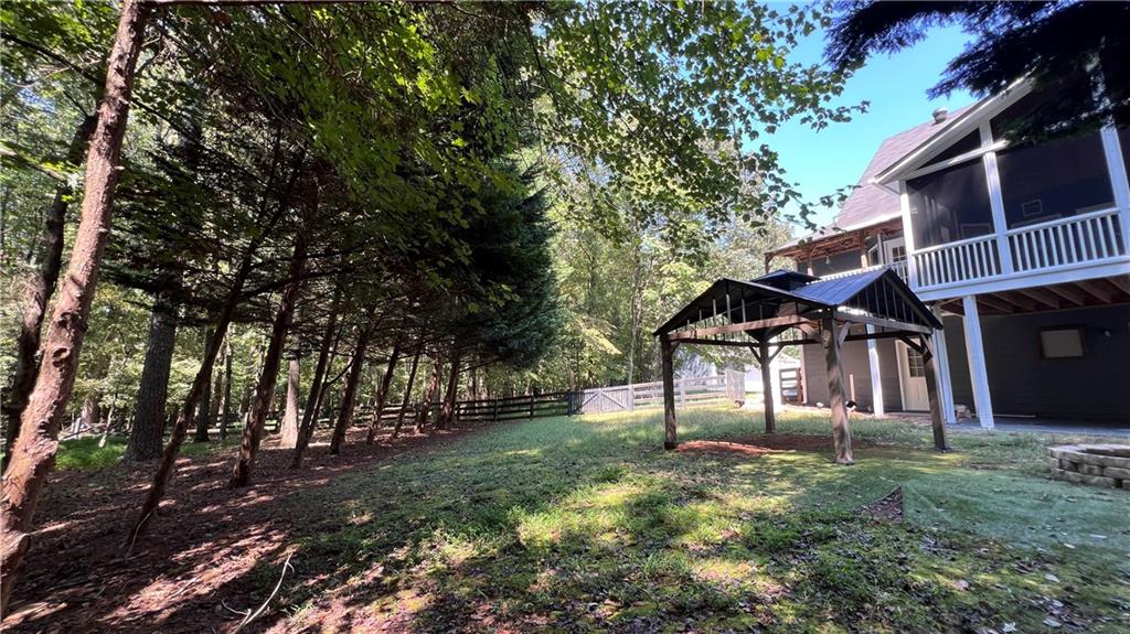 8434 Majors Road Cumming, GA 30041 - Photo 19 of 23 a view of house with yard