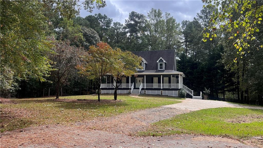 8434 Majors Road Cumming, GA 30041 - Photo 2 of 23 a view of a house with a yard