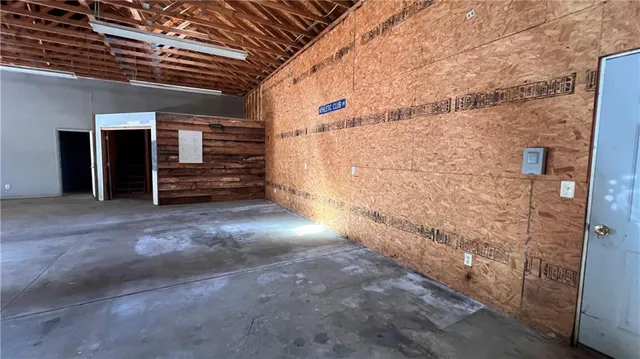 a view of an empty room with stairs