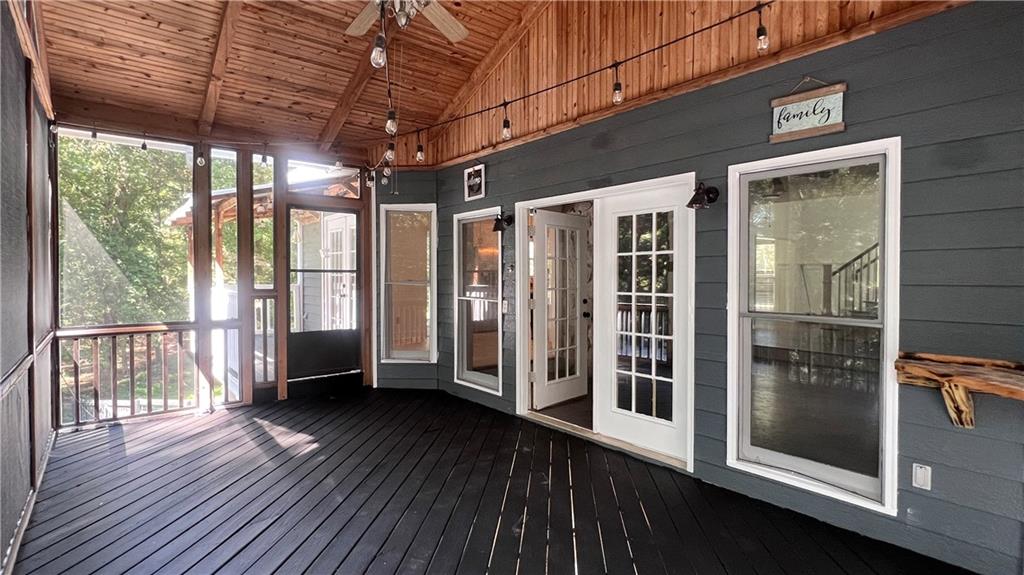 8434 Majors Road Cumming, GA 30041 - Photo 9 of 23 a view of a porch with wooden floor and iron stairs