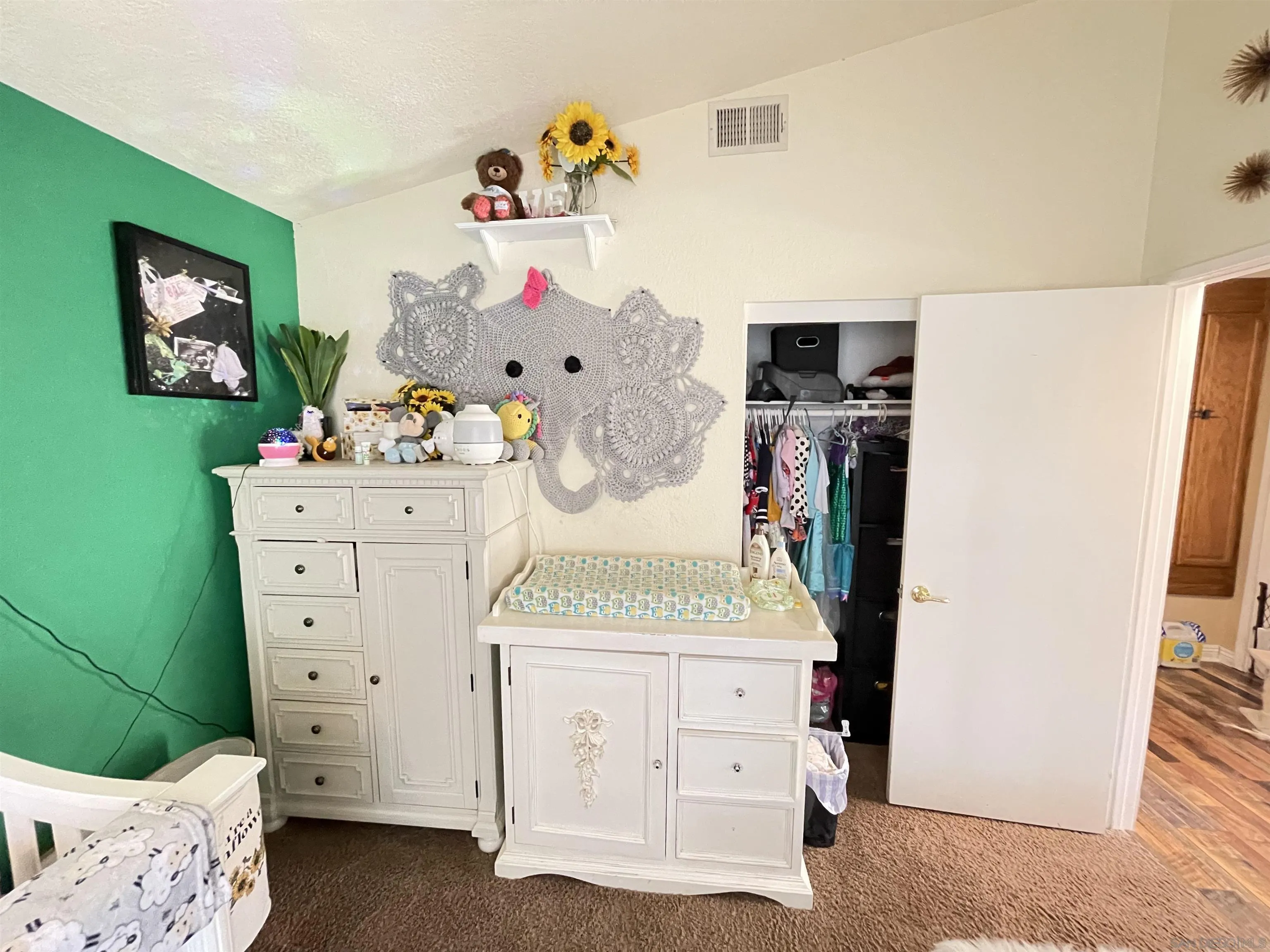 39490 Long Ridge Drive Temecula, CA 92591 - Photo 14 of 18 a spacious bedroom with a bed and a dresser in it