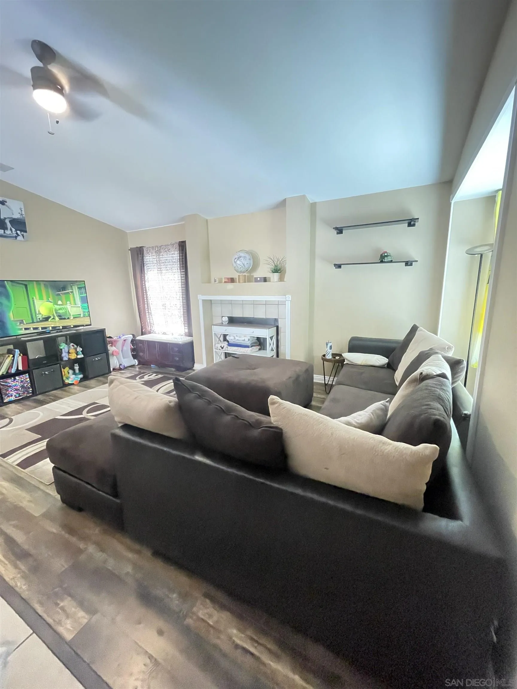 39490 Long Ridge Drive Temecula, CA 92591 - Photo 5 of 18 a living room with furniture and a fireplace