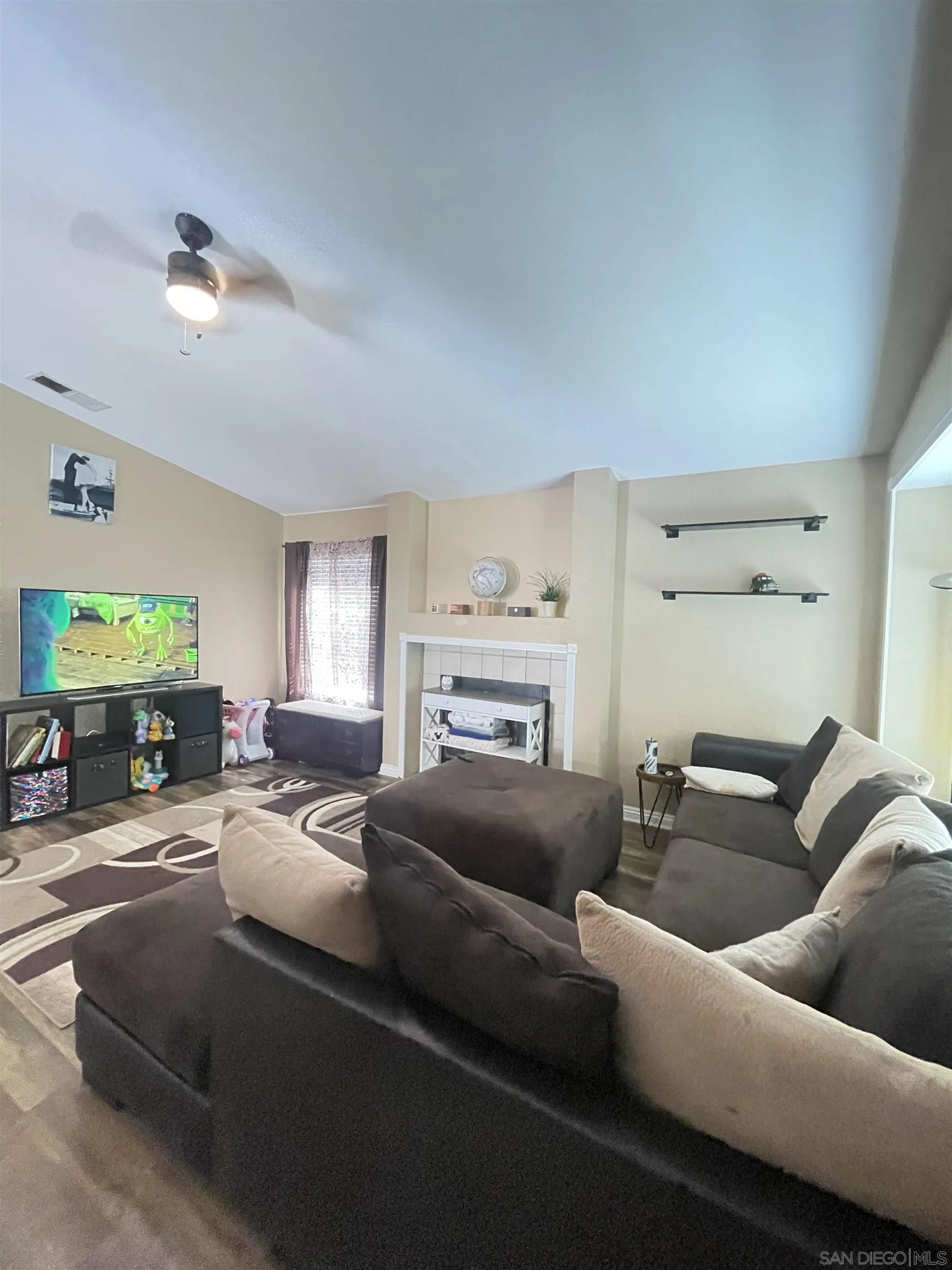 39490 Long Ridge Drive Temecula, CA 92591 - Photo 6 of 18 a living room with furniture and a fireplace