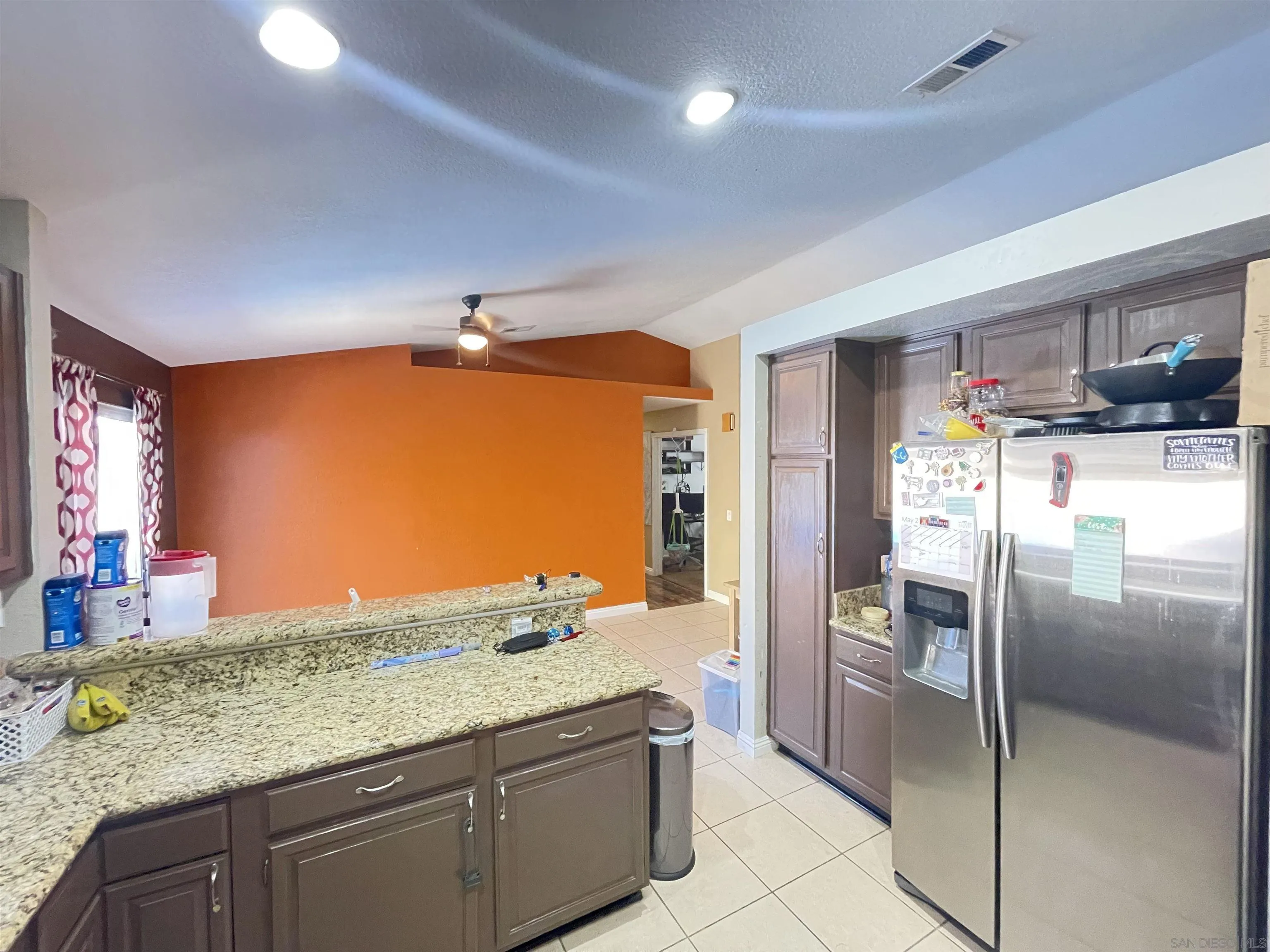 39490 Long Ridge Drive Temecula, CA 92591 - Photo 9 of 18 a kitchen with stainless steel appliances granite countertop a refrigerator and a sink
