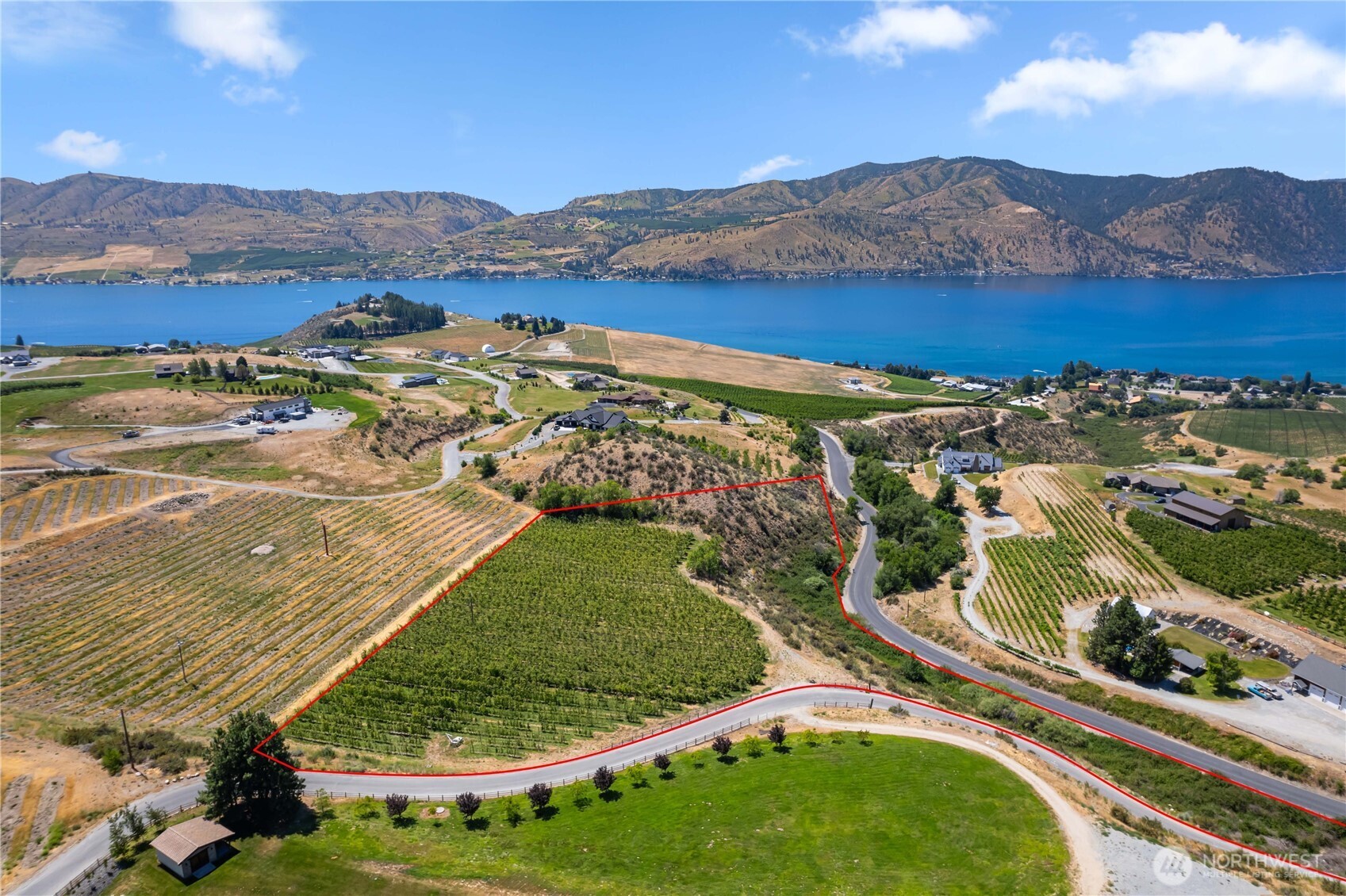 an aerial view of residential houses and outdoor space