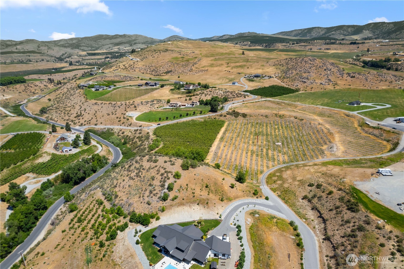 200 Lakayuse Road Manson, WA 98831 - Photo 16 of 21 an aerial view of a house with a lake view