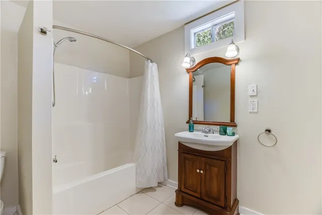 a bathroom with a sink a vanity and a mirror