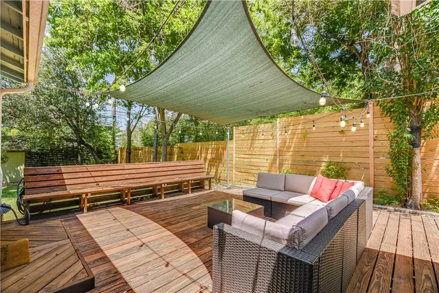 a view of a backyard with sitting area