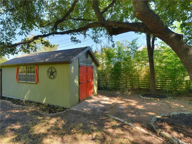 a view of an empty room with a staircase
