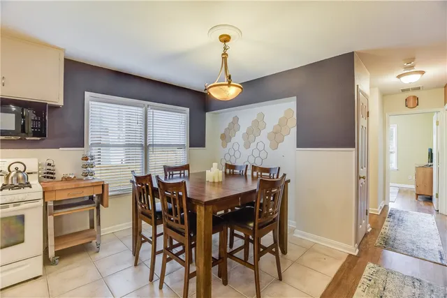 a kitchen with a table and chairs in it