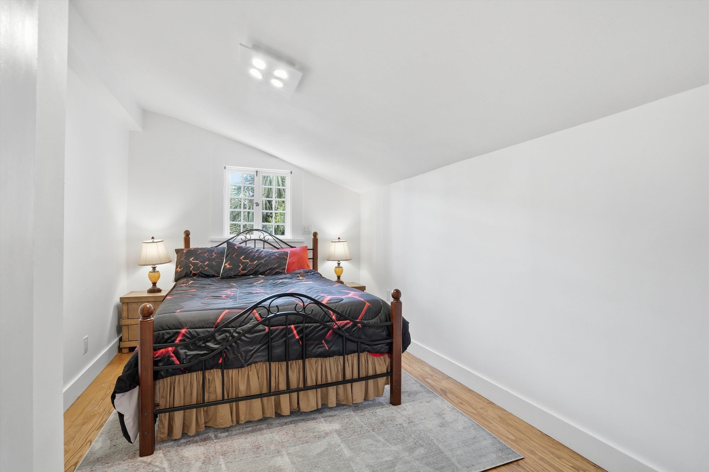 76 Oneida Street St. Augustine, FL 32084 - Photo 26 of 38 a bedroom with a bed and a window