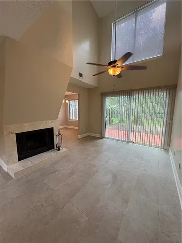 a view of an empty room with windows