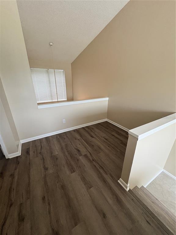 9360 Craven Road, Unit 1104 Jacksonville, FL 32257 - Photo 13 of 25 a view of an empty room with wooden floor and a window