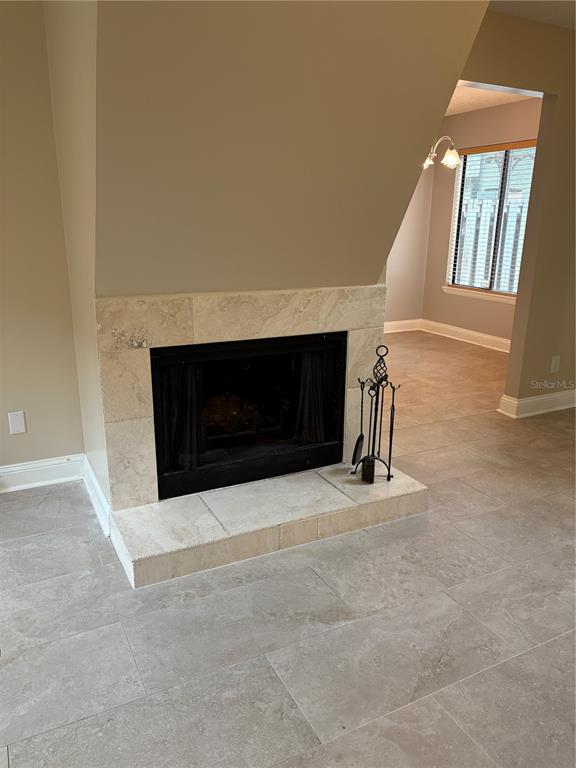 9360 Craven Road, Unit 1104 Jacksonville, FL 32257 - Photo 10 of 25 a living room with a fireplace and a large window