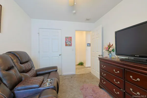 a view of a house with a yard and sitting area