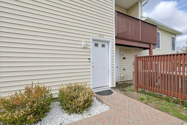 an aerial view of multiple houses with yard