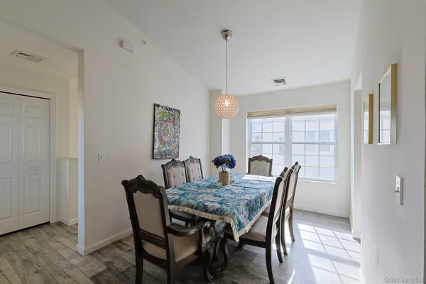 a kitchen with cabinets stainless steel appliances and a sink