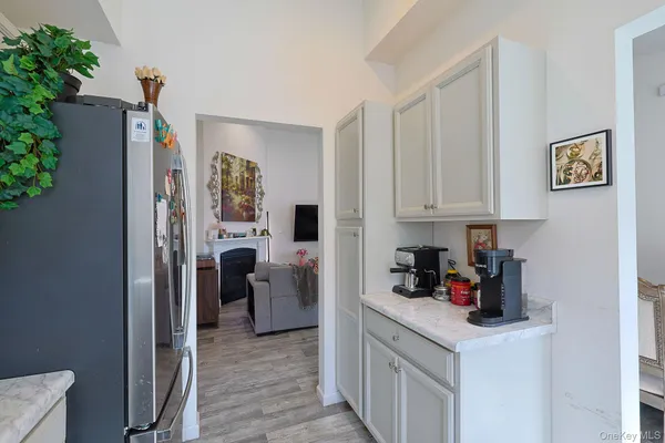 a bathroom with a sink and mirror with toilet