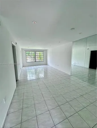 a view of an empty room and a window