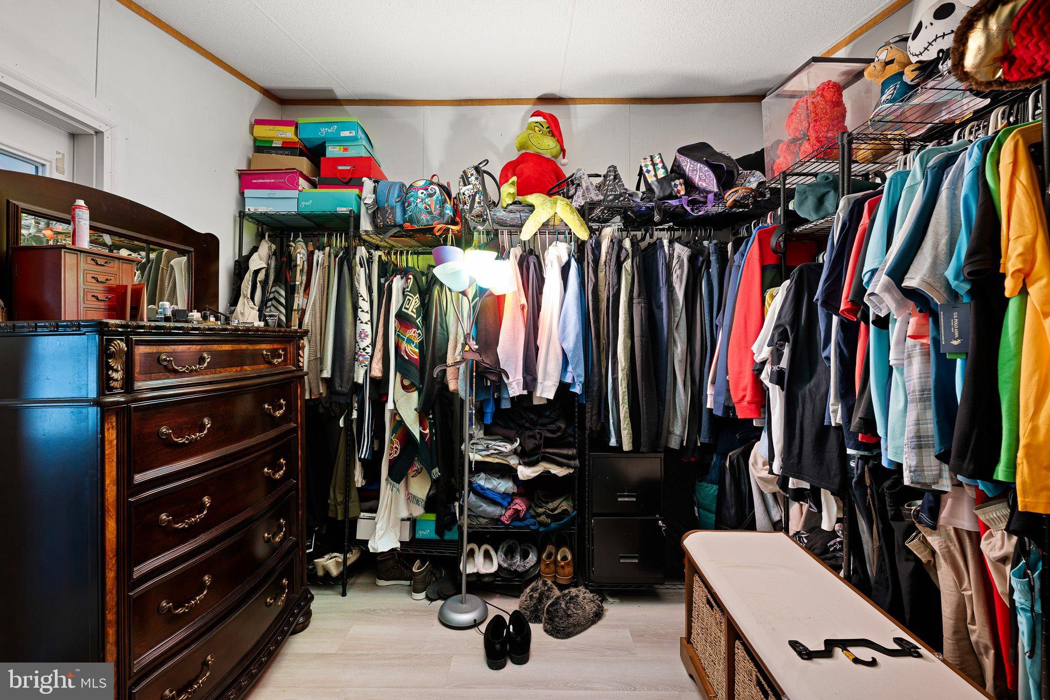 1650 Cypress Branch Road Magnolia, DE 19962 - Photo 20 of 35 Colorful chaos in a vibrant closet space.
