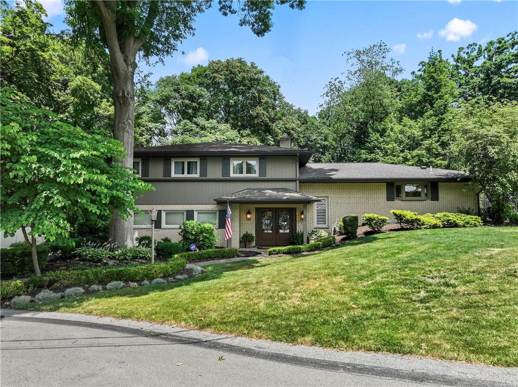 front view of a house with a yard