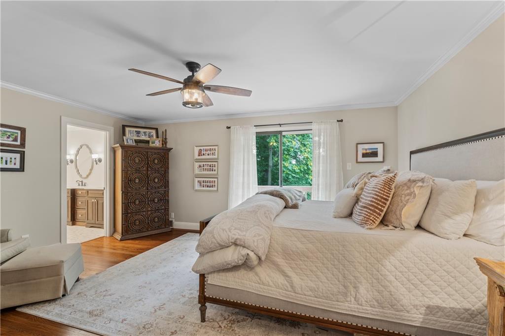 102 Forest Drive Beaver, PA 15009 - Photo 21 of 32 a bedroom with a large bed and a chandelier