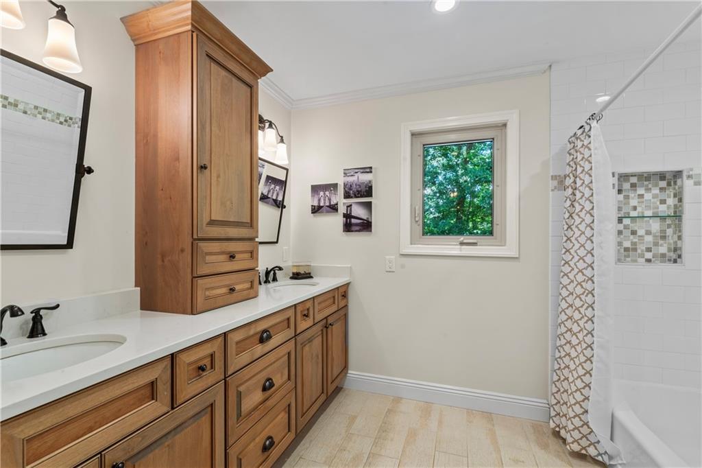 102 Forest Drive Beaver, PA 15009 - Photo 26 of 32 a spacious bathroom with a double vanity sink a mirror and a shower