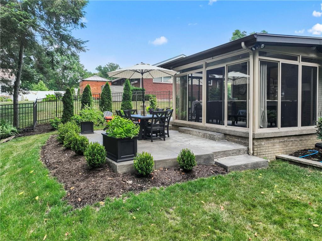 102 Forest Drive Beaver, PA 15009 - Photo 6 of 32 a front view of a house with porch and garden