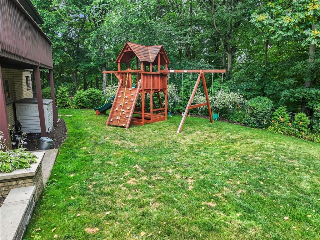 102 Forest Drive Beaver, PA 15009 - Photo 8 of 32 a view of playground with a slide and swing