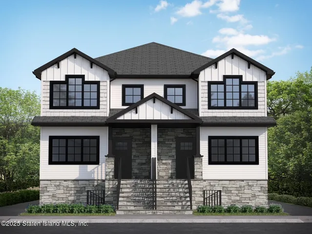 a front view of a house with garage