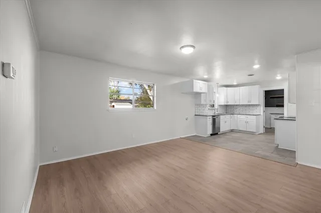 an empty room with windows and pillars in it